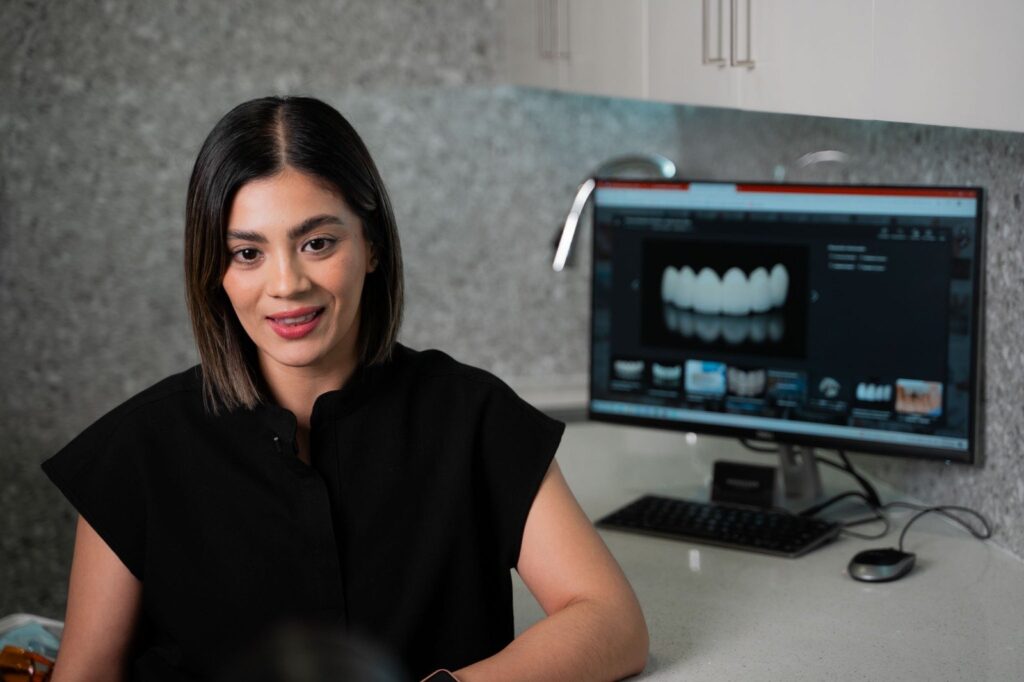 Dra. Karla P. Ramírez reviewing a digital smile design at Makeover Dental Studio in Tijuana