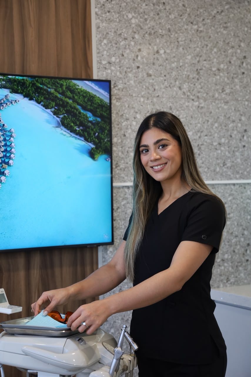 Dental assistant at a treatment unit in Makeover Dental Studio, Tijuana