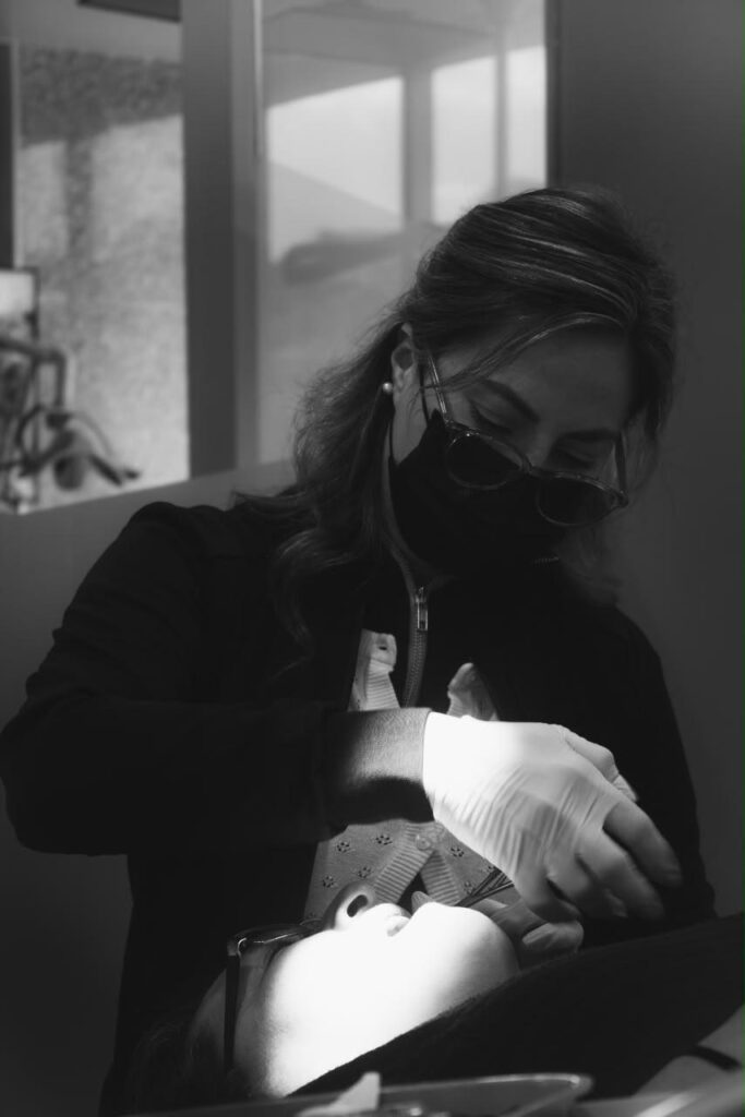 Specialist treating a patient at Makeover Dental Studio in Tijuana