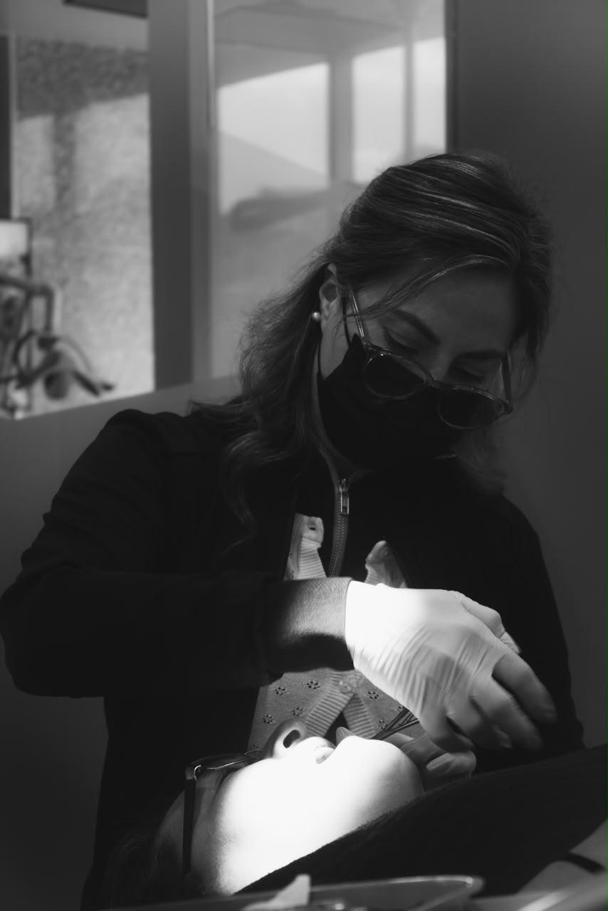 Specialist treating a patient at Makeover Dental Studio in Tijuana