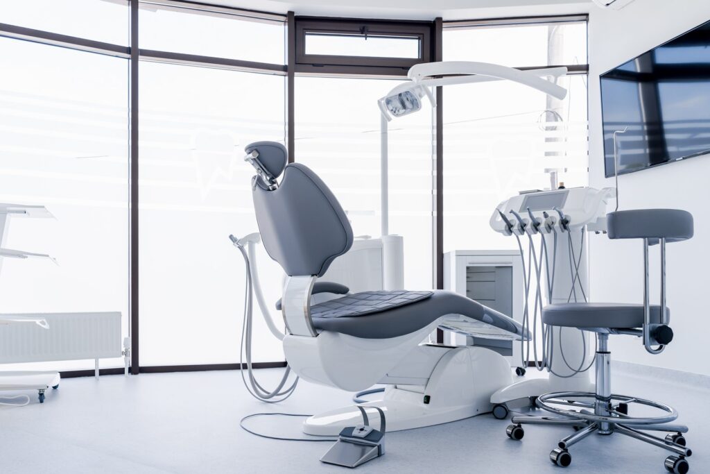 Dental office with a large window and a grey chair