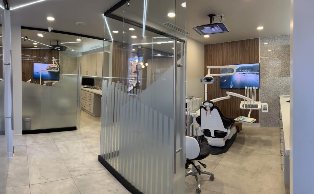 Treatment room with glass partitions at Makeover Dental Studio in Tijuana
